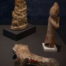 Three small antique sculptures, one lying